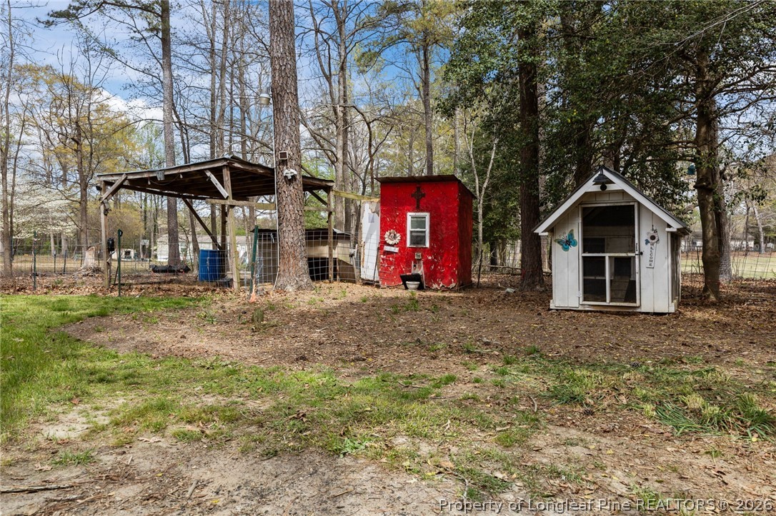 432 Pearidge Road Willow Spring, NC 27592 - Photo 36 of 47 a view of a house with a yard