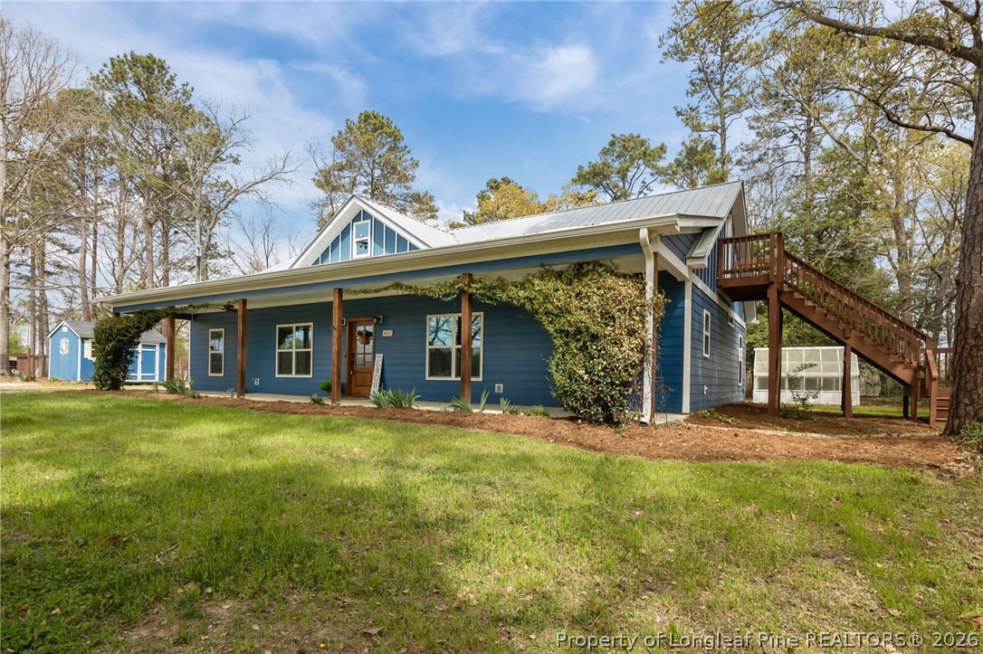 432 Pearidge Road Willow Spring, NC 27592 - Photo 37 of 47 a view of a house with a yard