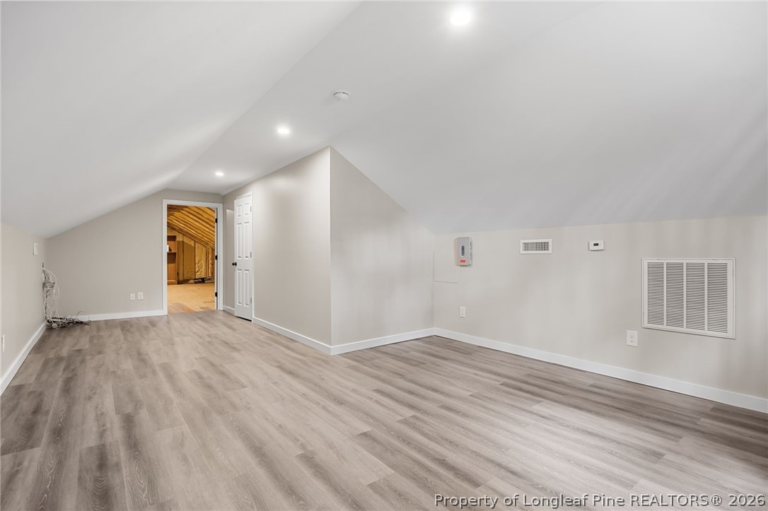 432 Pearidge Road Willow Spring, NC 27592 - Photo 38 of 47 a view of empty room with wooden floor