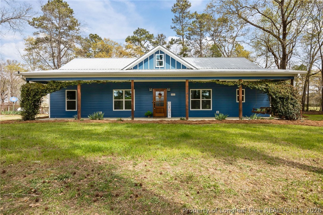 432 Pearidge Road Willow Spring, NC 27592 - Photo 4 of 47 a view of a house with a backyard