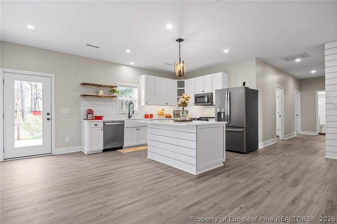 432 Pearidge Road Willow Spring, NC 27592 - Photo 5 of 47 a kitchen with stainless steel appliances a refrigerator sink and cabinets