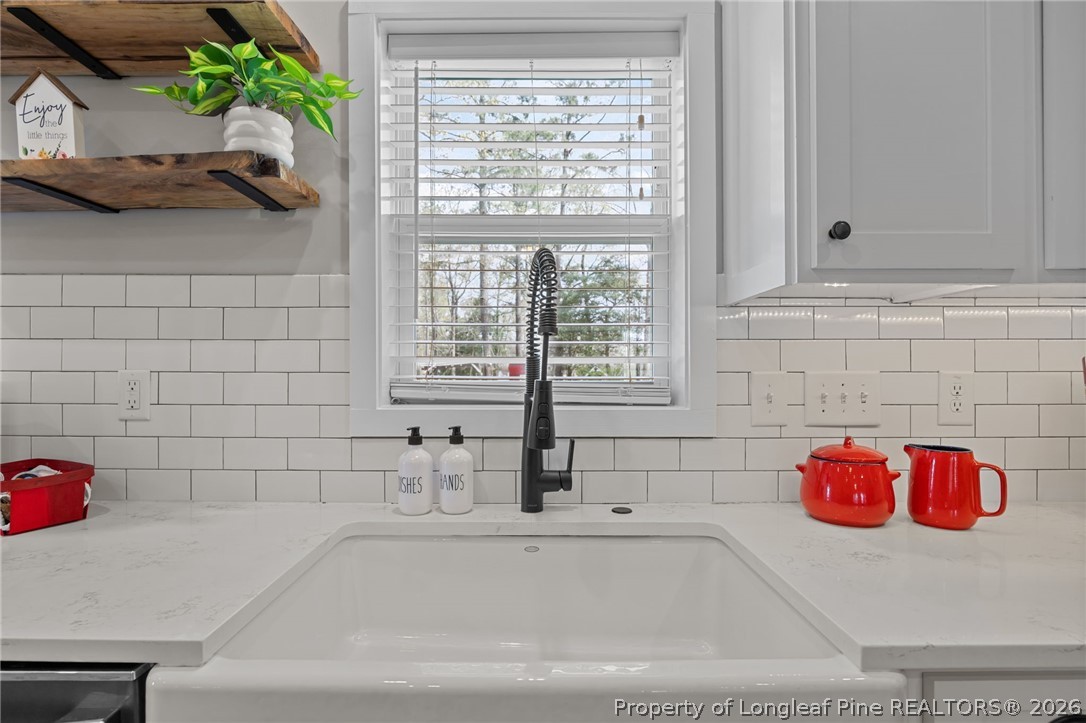 432 Pearidge Road Willow Spring, NC 27592 - Photo 9 of 47 a bathroom with a tub a sink and a window