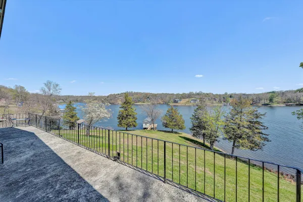 a view of a balcony with lake view and mountain view