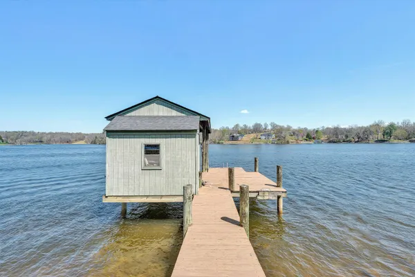 a roof deck with a table and chairs