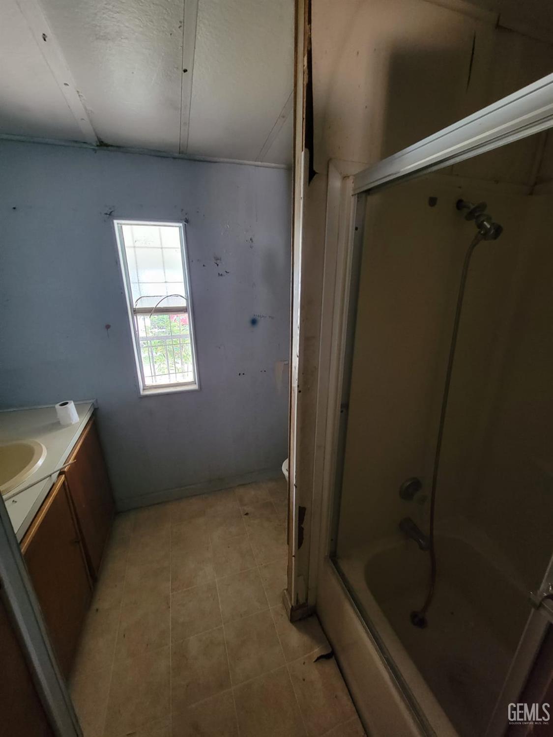 Undisclosed Address Delano, CA 93215 - Photo 8 of 8 a bathroom with a shower and toilet