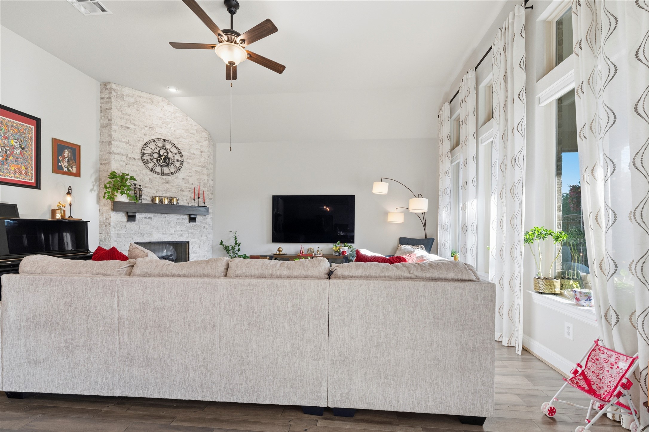 138 Rpd Spgs Cove Georgetown, TX 78628 - Photo 23 of 37 a living room with furniture and a flat screen tv