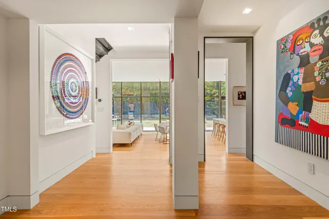 a living room with fireplace furniture and a chandelier