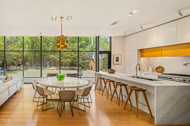 a very nice looking living room with a painting on the wall
