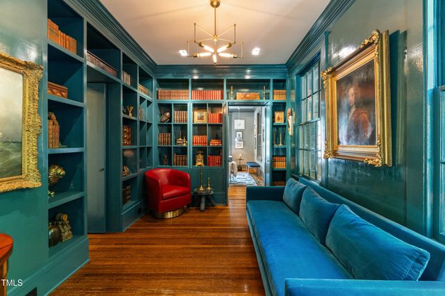a balcony with furniture and a potted plant