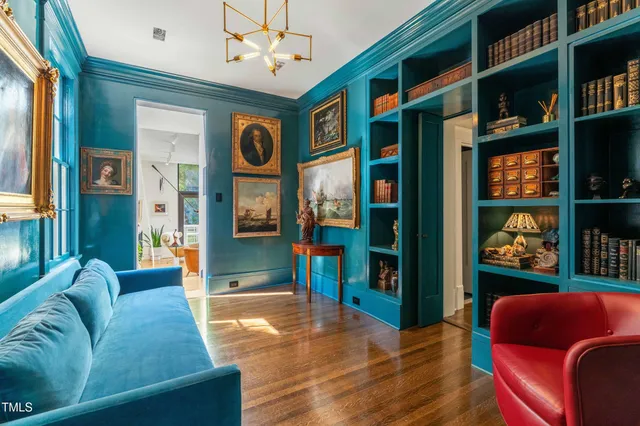 a living room with furniture cabinets and window