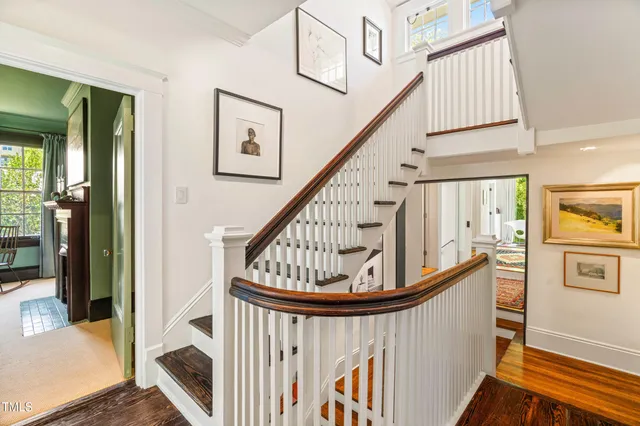 a view of entryway with wooden floor and stairs