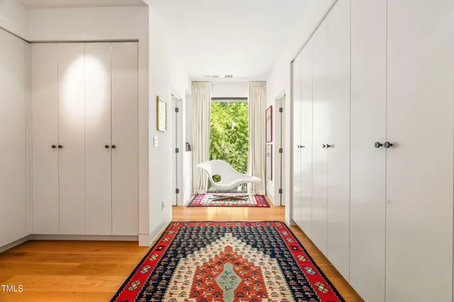 a view of an entryway with wooden floor