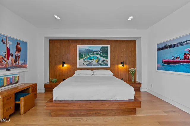 a bedroom with a bed and dresser