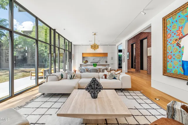 a living room with fireplace furniture and a flat screen tv