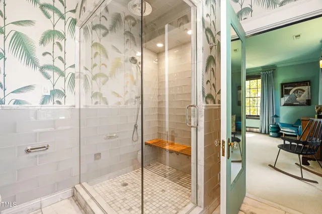 a bathroom with a double vanity sink mirror and shower