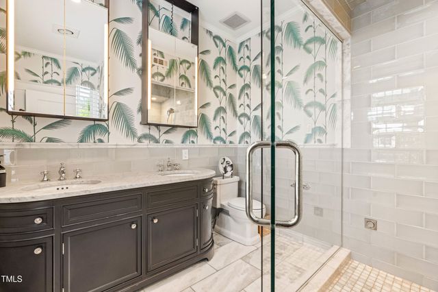 a bed room with a bed and a chair