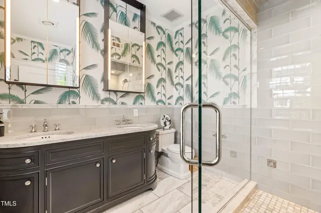 a bed room with a bed and a chair