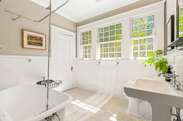 a room with furniture pool table and windows