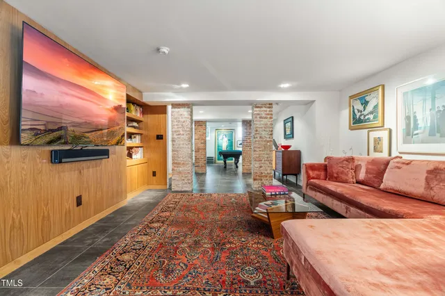 a spacious bathroom with a sink and a mirror