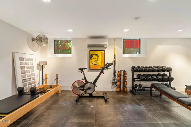 a bedroom with a bed and a book shelf