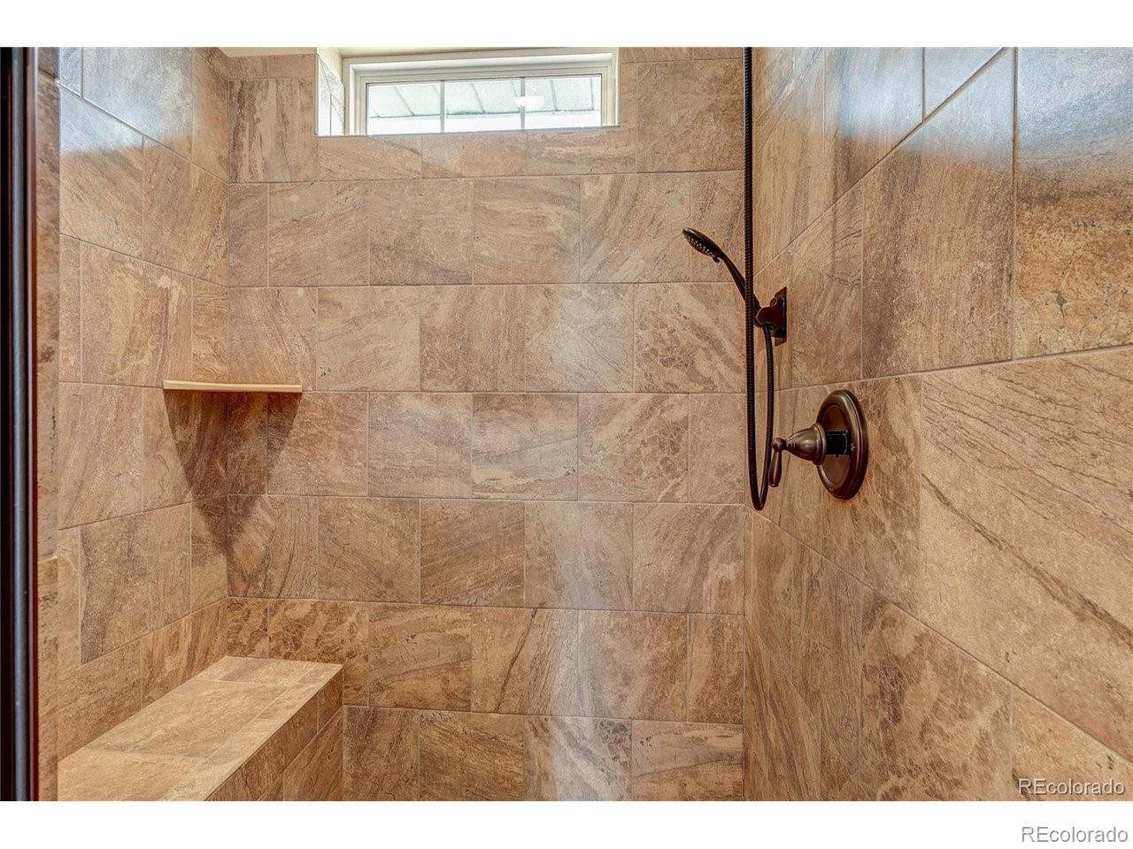 18298 Romar Rnch Road Carr, CO 80612 - Photo 22 of 49 a bathroom with a shower