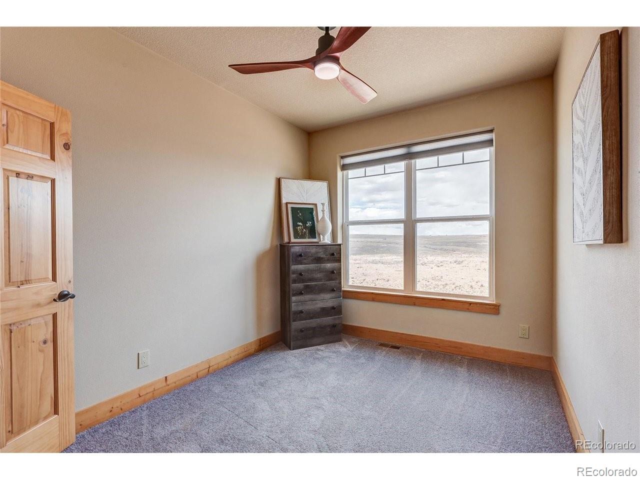 18298 Romar Rnch Road Carr, CO 80612 - Photo 23 of 49 a view of an empty room with a window