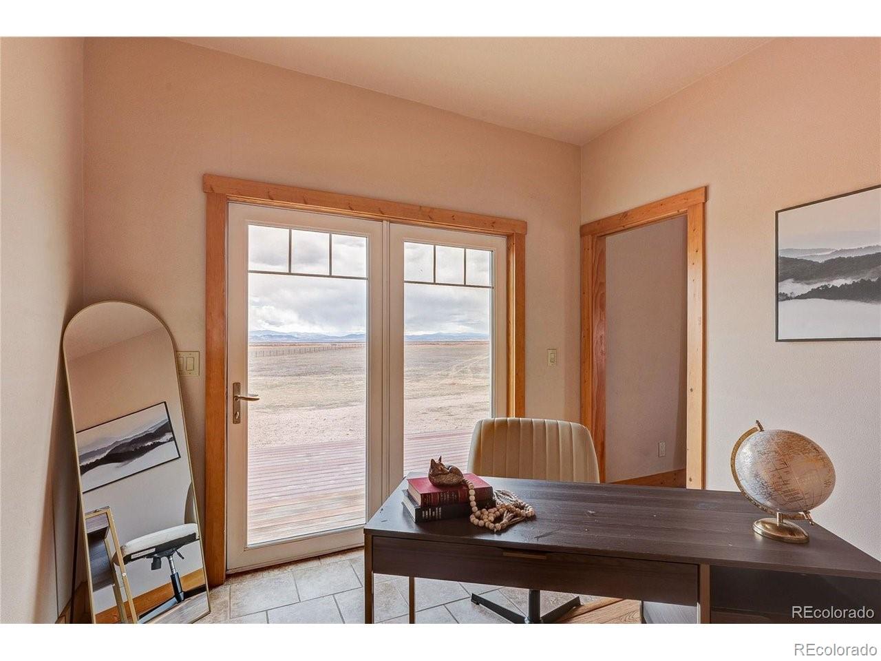 18298 Romar Rnch Road Carr, CO 80612 - Photo 30 of 49 a living room with furniture and a window