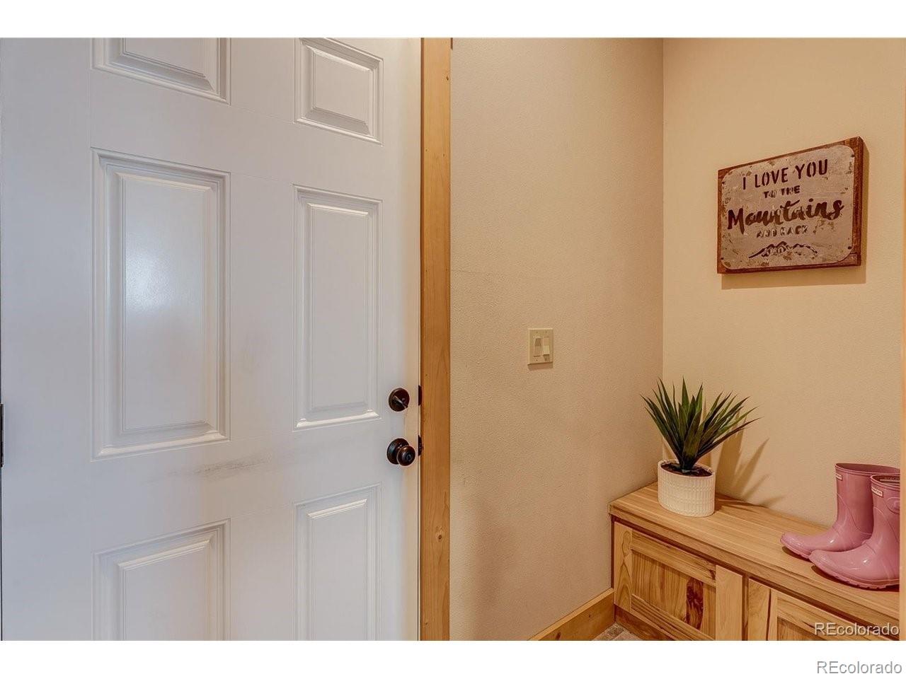 18298 Romar Rnch Road Carr, CO 80612 - Photo 31 of 49 a view of a hallway with a elevator