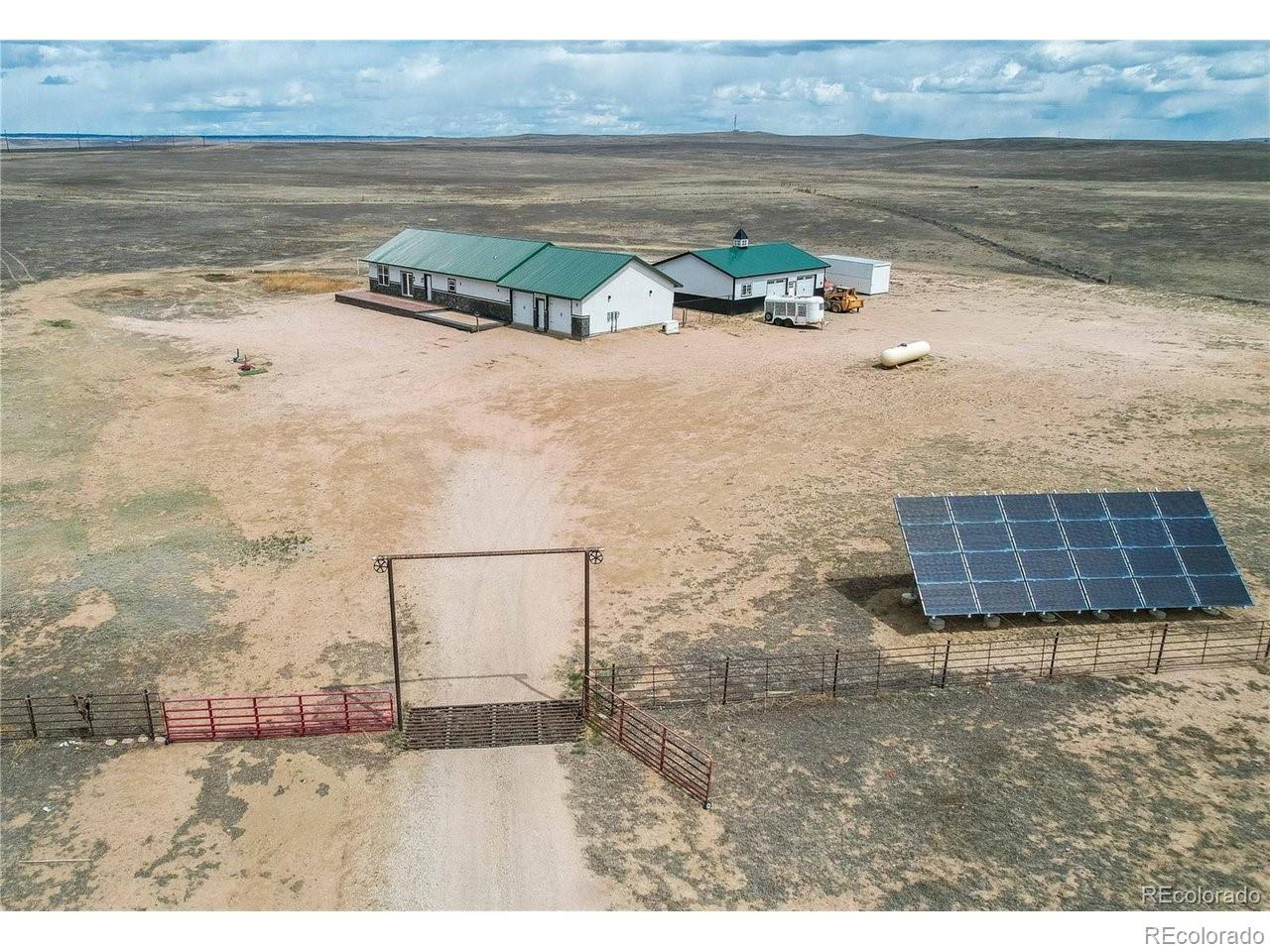 18298 Romar Rnch Road Carr, CO 80612 - Photo 36 of 49 a view of a terrace with wooden floor