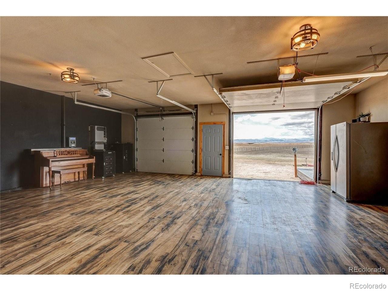 18298 Romar Rnch Road Carr, CO 80612 - Photo 7 of 49 a view of a room with wooden floor