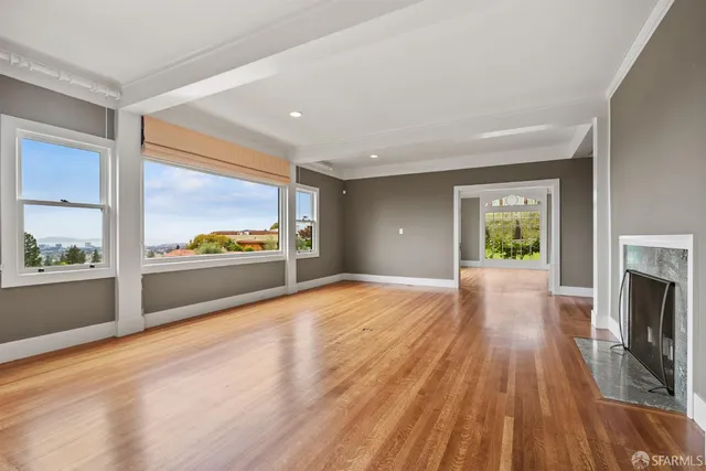 a view of an entryway with wooden floors