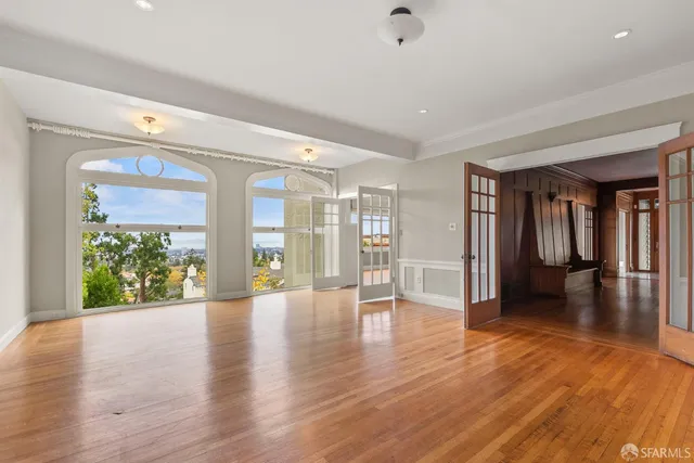 a kitchen with stainless steel appliances granite countertop a stove a sink and a window