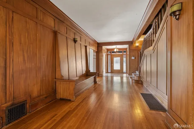 a living room with couches and a fireplace