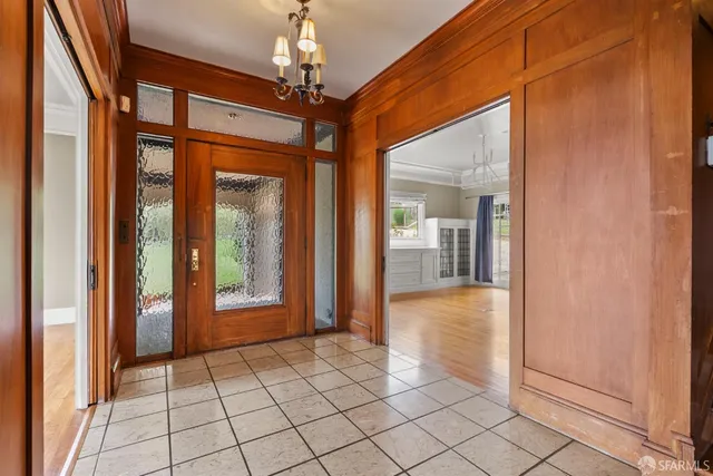 a bathroom with a toilet a sink and a large mirror