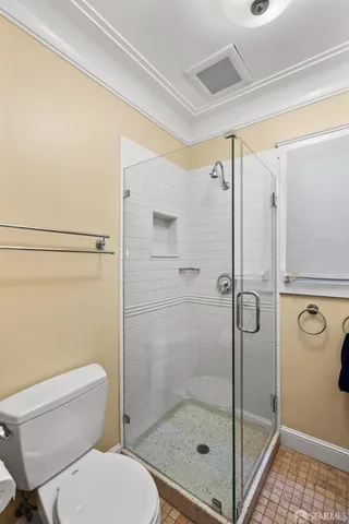 a bathroom with a shower and a sink