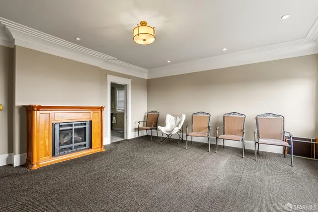 a view of a room with a fan and a fan