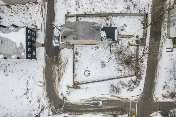 an aerial view of residential building and parking space