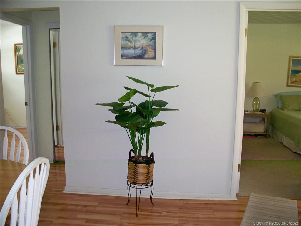 1913 Southwest Palm City Road, Unit 7B Stuart, FL 34994 - Photo 5 of 37 a vase of flowers sitting on a table