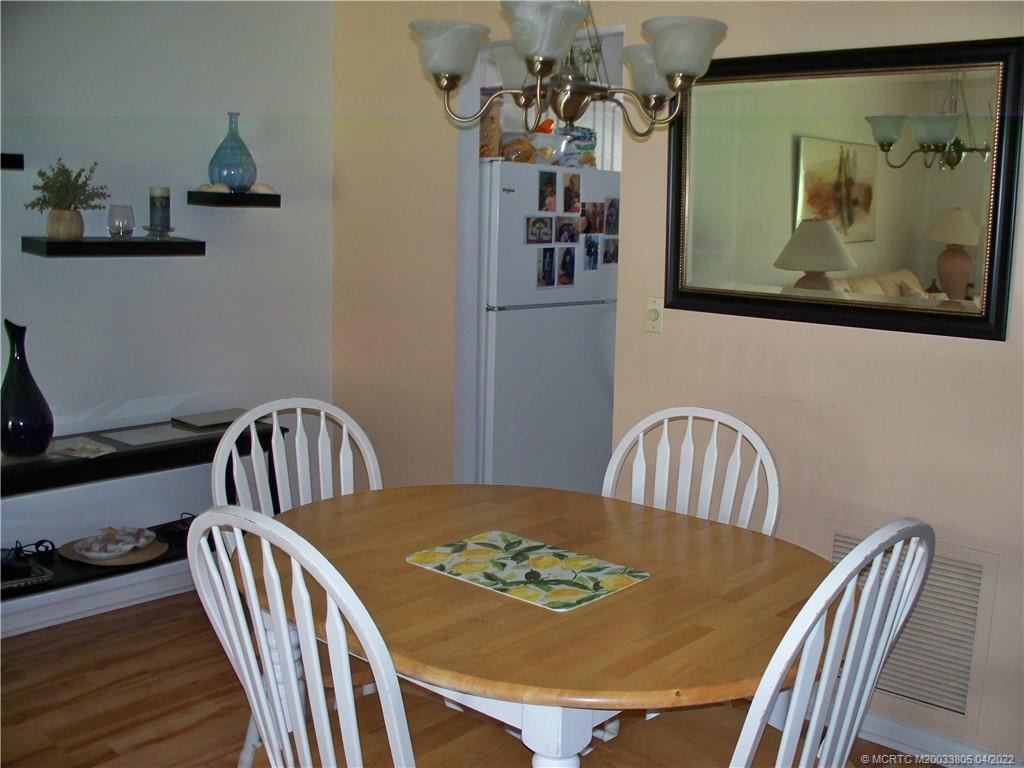 1913 Southwest Palm City Road, Unit 7B Stuart, FL 34994 - Photo 8 of 37 a view of a dining room with furniture