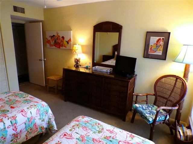 a bedroom with a bed and furniture