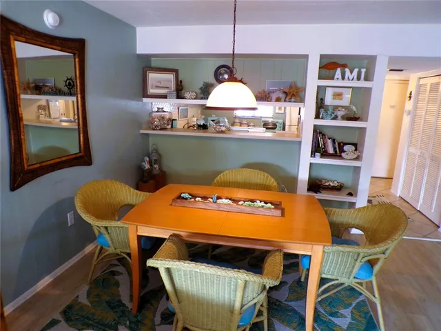 a view of a dining room with furniture and window