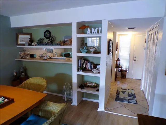 a room with a workspace and a window