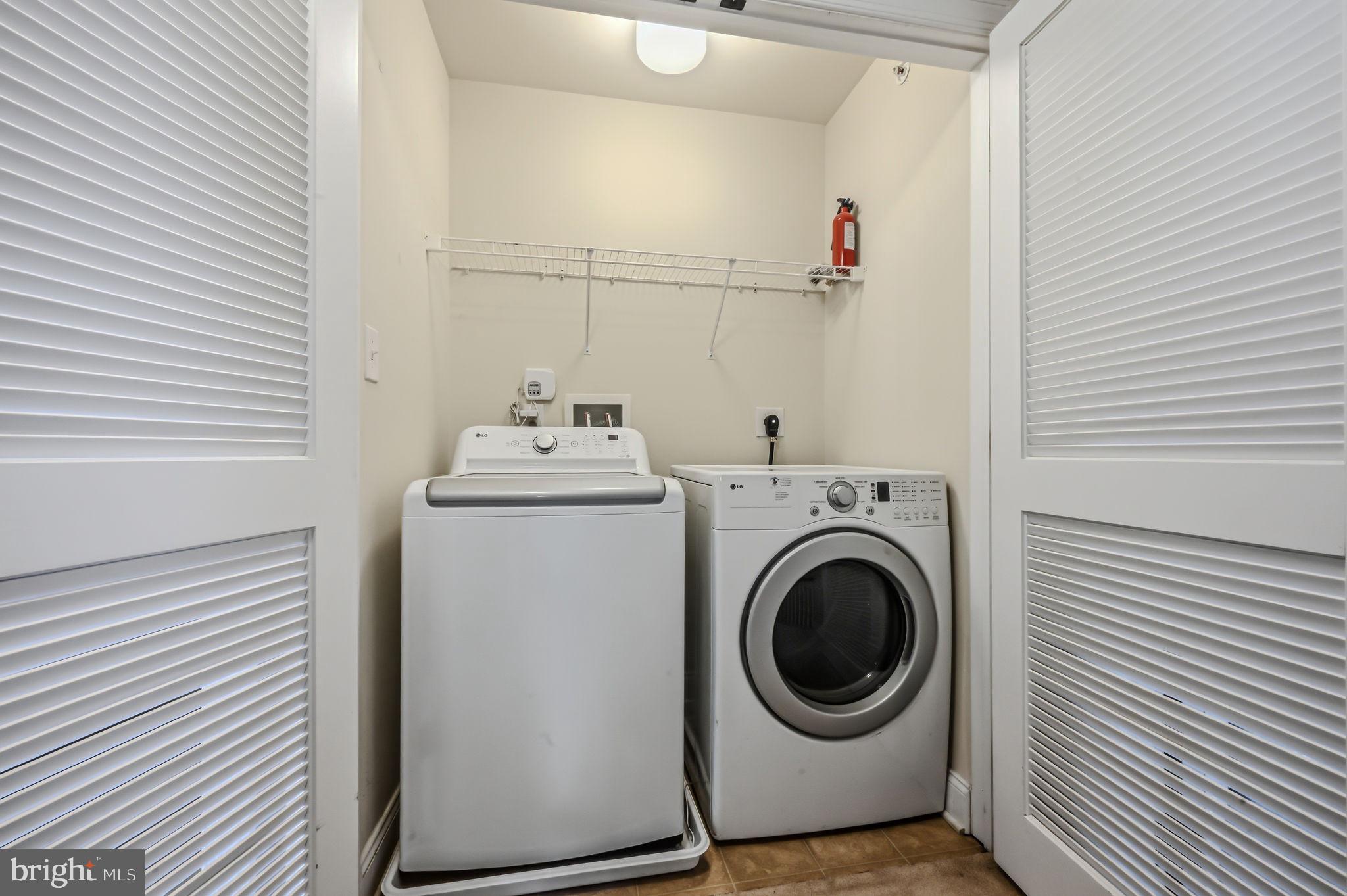208 Jackdaw Alley, Unit 208 Springfield, PA 19064 - Photo 39 of 49 a utility room with dryer and washer