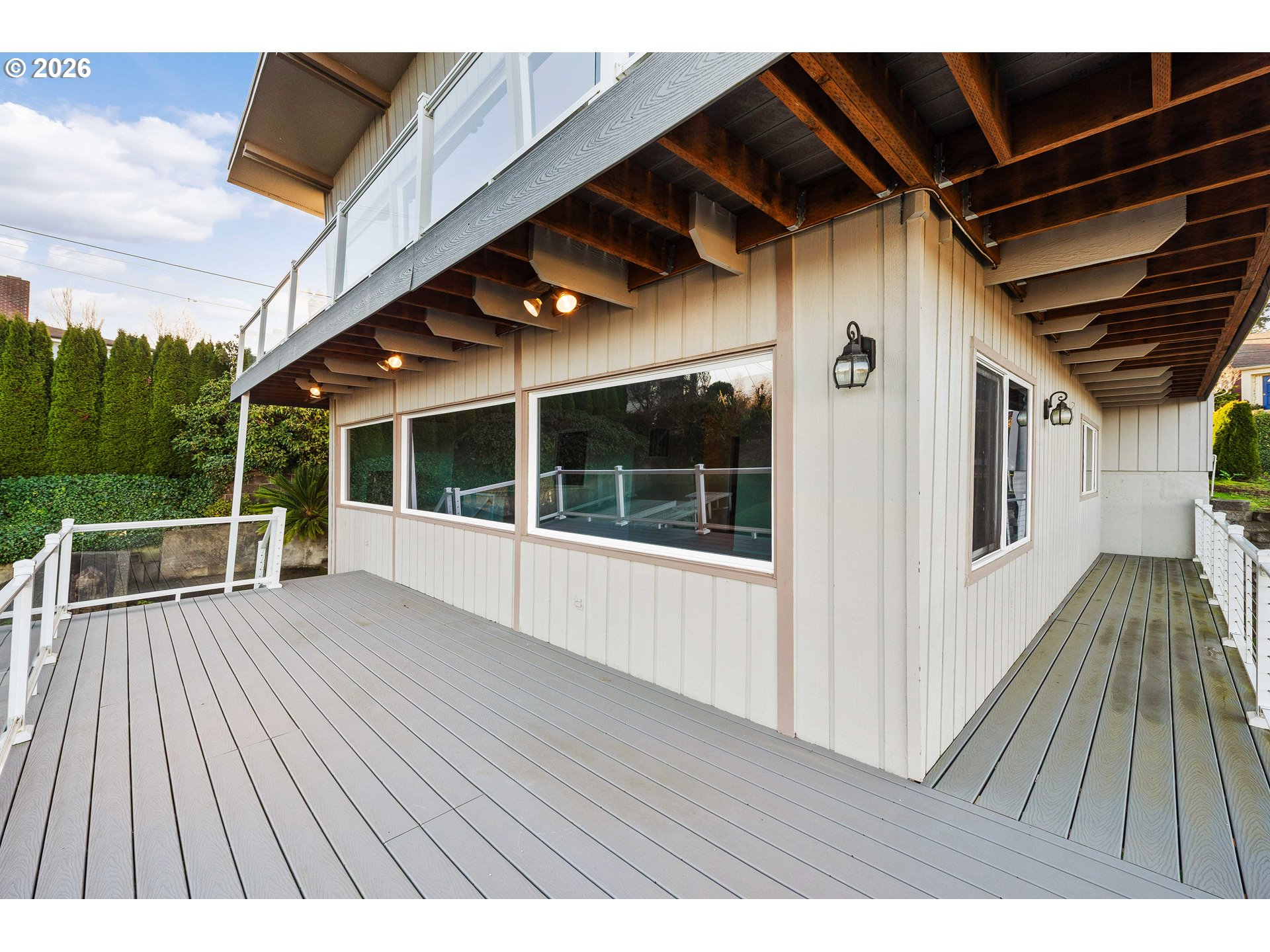 451 Simpson Avenue North Bend, OR 97459 - Photo 11 of 41 a view of balcony with floor to ceiling windows with wooden floor