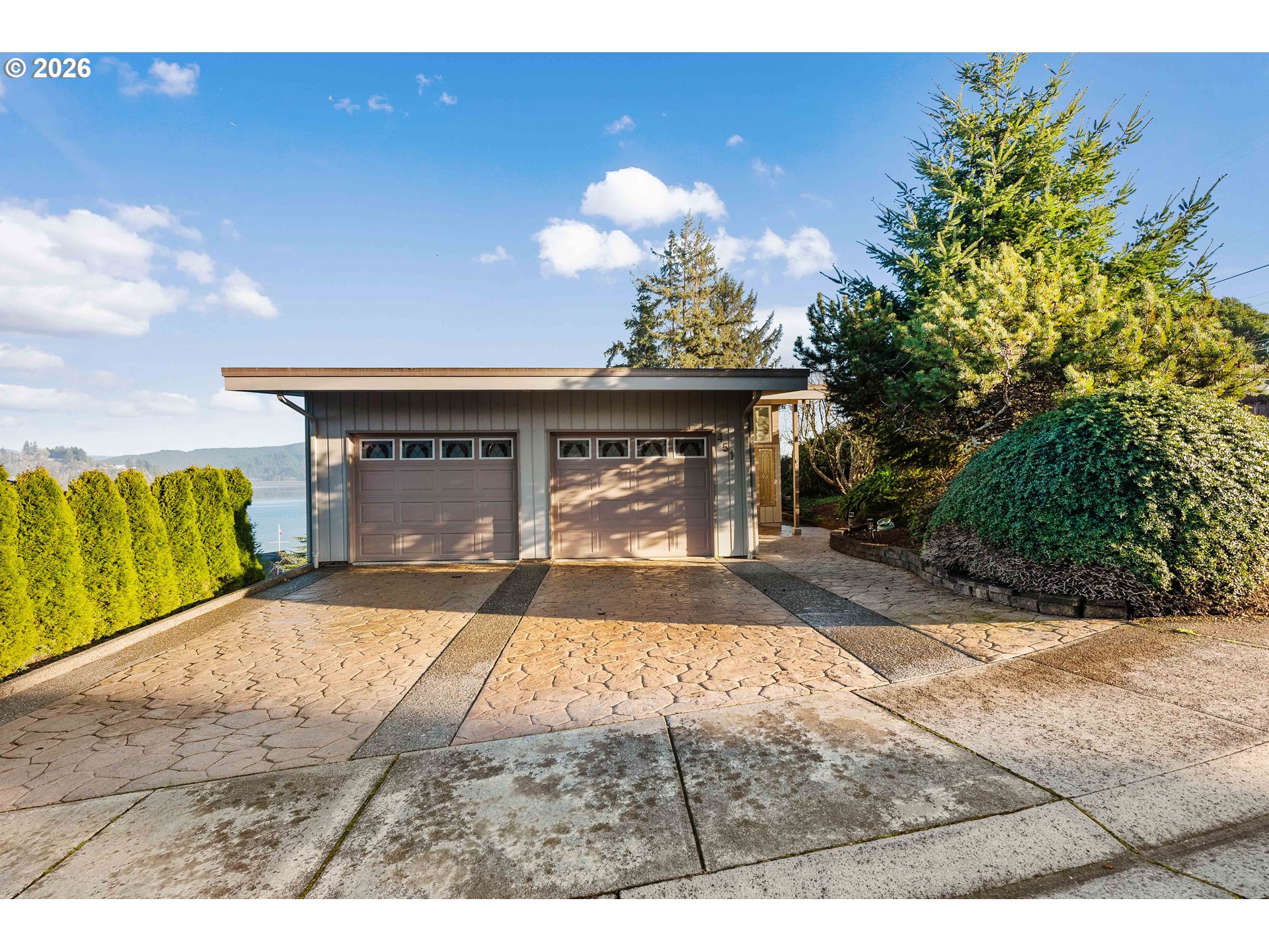 451 Simpson Avenue North Bend, OR 97459 - Photo 12 of 41 a view of a house with a patio