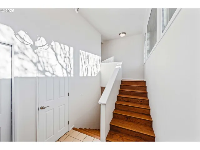 a view of entryway with stairs and wooden floor