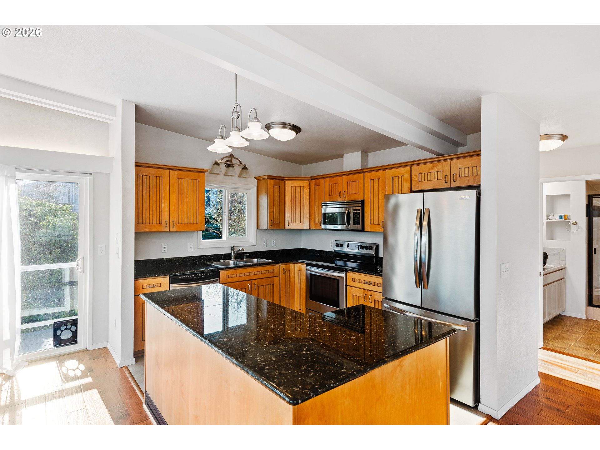 451 Simpson Avenue North Bend, OR 97459 - Photo 17 of 41 a kitchen with stainless steel appliances granite countertop a sink a stove and a refrigerator