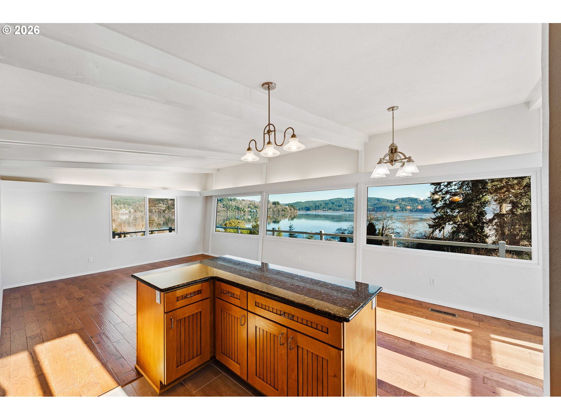 451 Simpson Avenue North Bend, OR 97459 - Photo 18 of 41 a kitchen with a sink and large windows