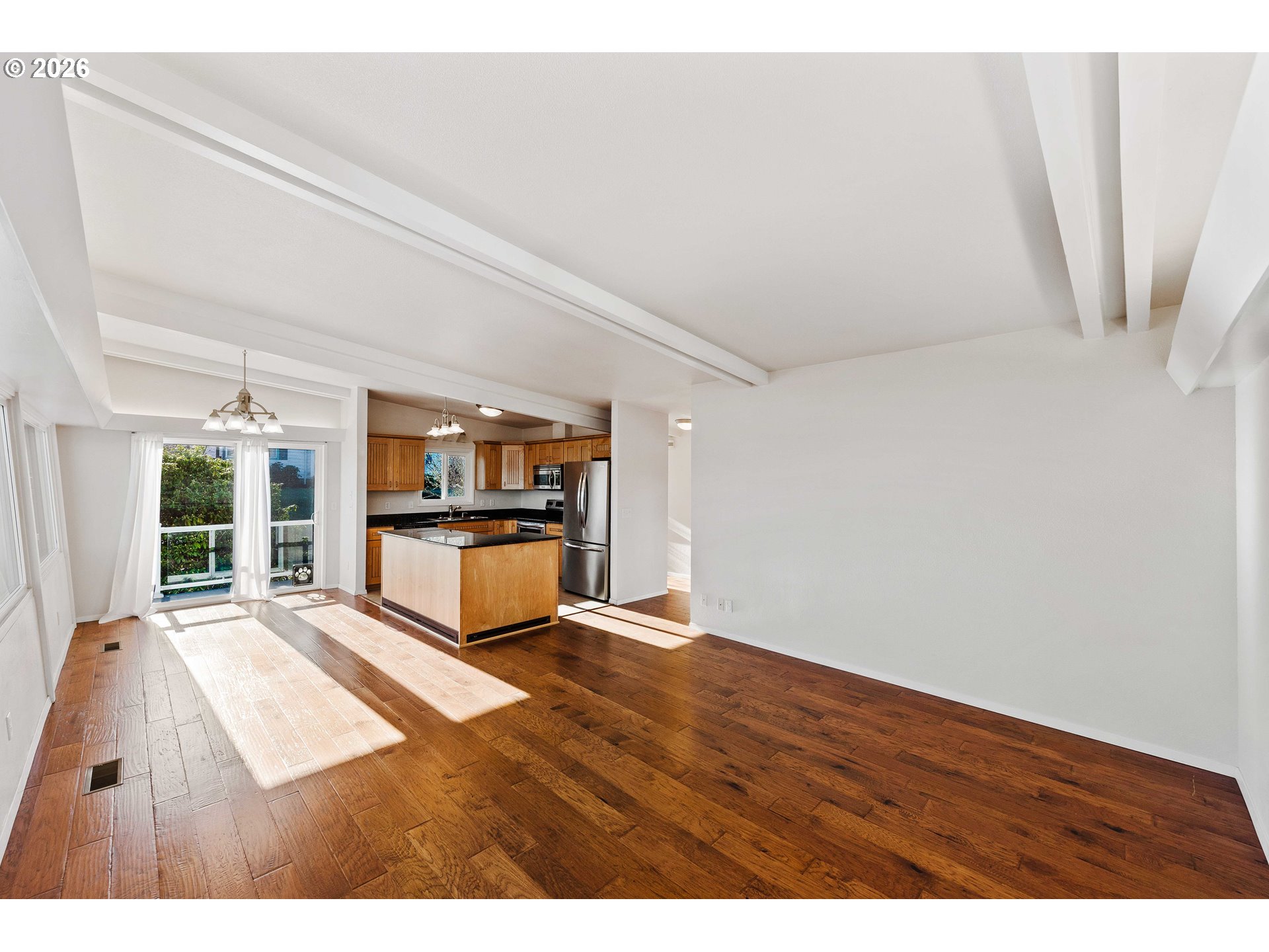 451 Simpson Avenue North Bend, OR 97459 - Photo 19 of 41 a view of an empty room with kitchen
