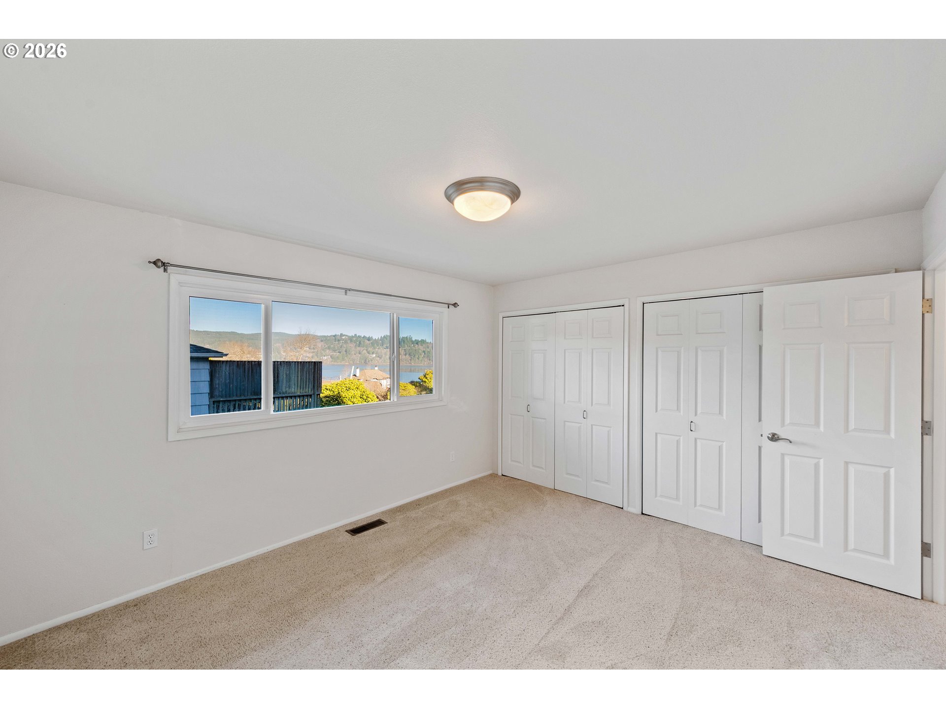 451 Simpson Avenue North Bend, OR 97459 - Photo 32 of 41 a view of an empty room with window